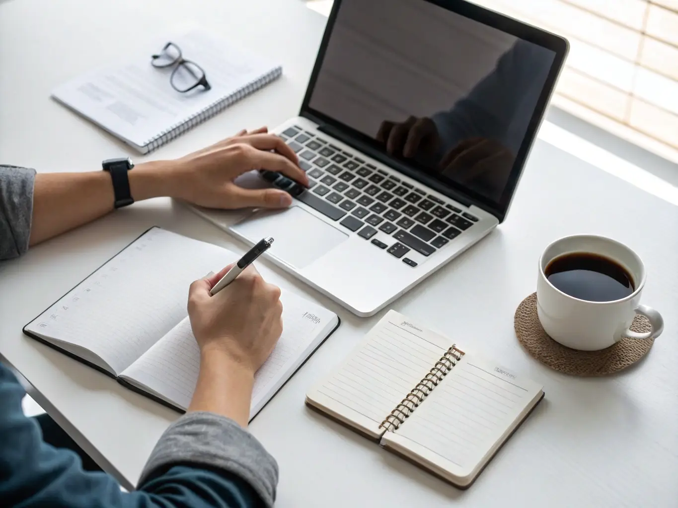 A person working at a desk with enhanced focus and productivity, using a laptop with a clean, organized workspace. The image represents the focus and clarity benefits of the Premium Blends collection.